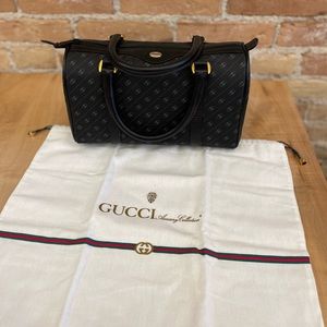Vintage black Gucci bag with dust cover